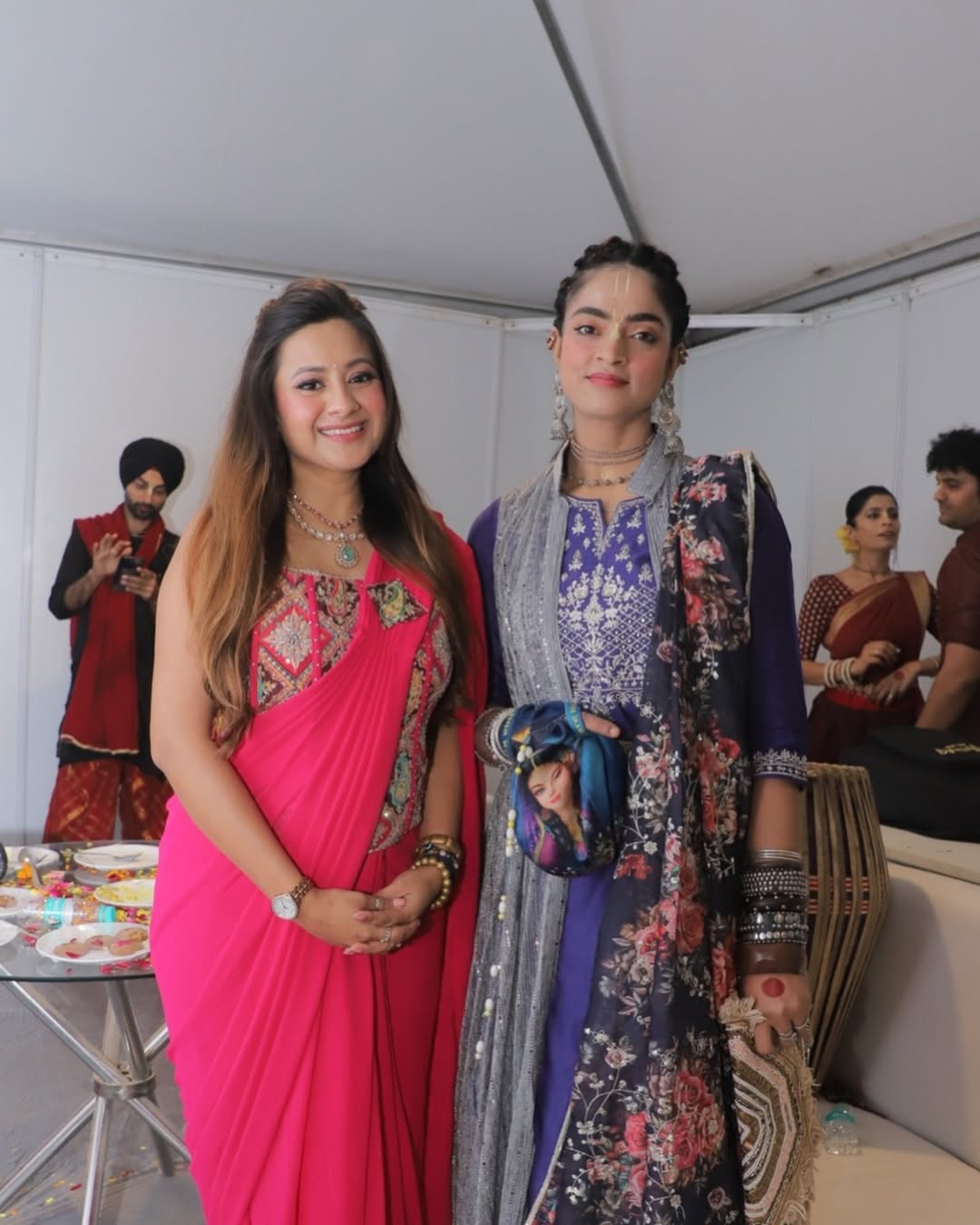 Nikita Rajput backstage with performing artists at a cultural festival