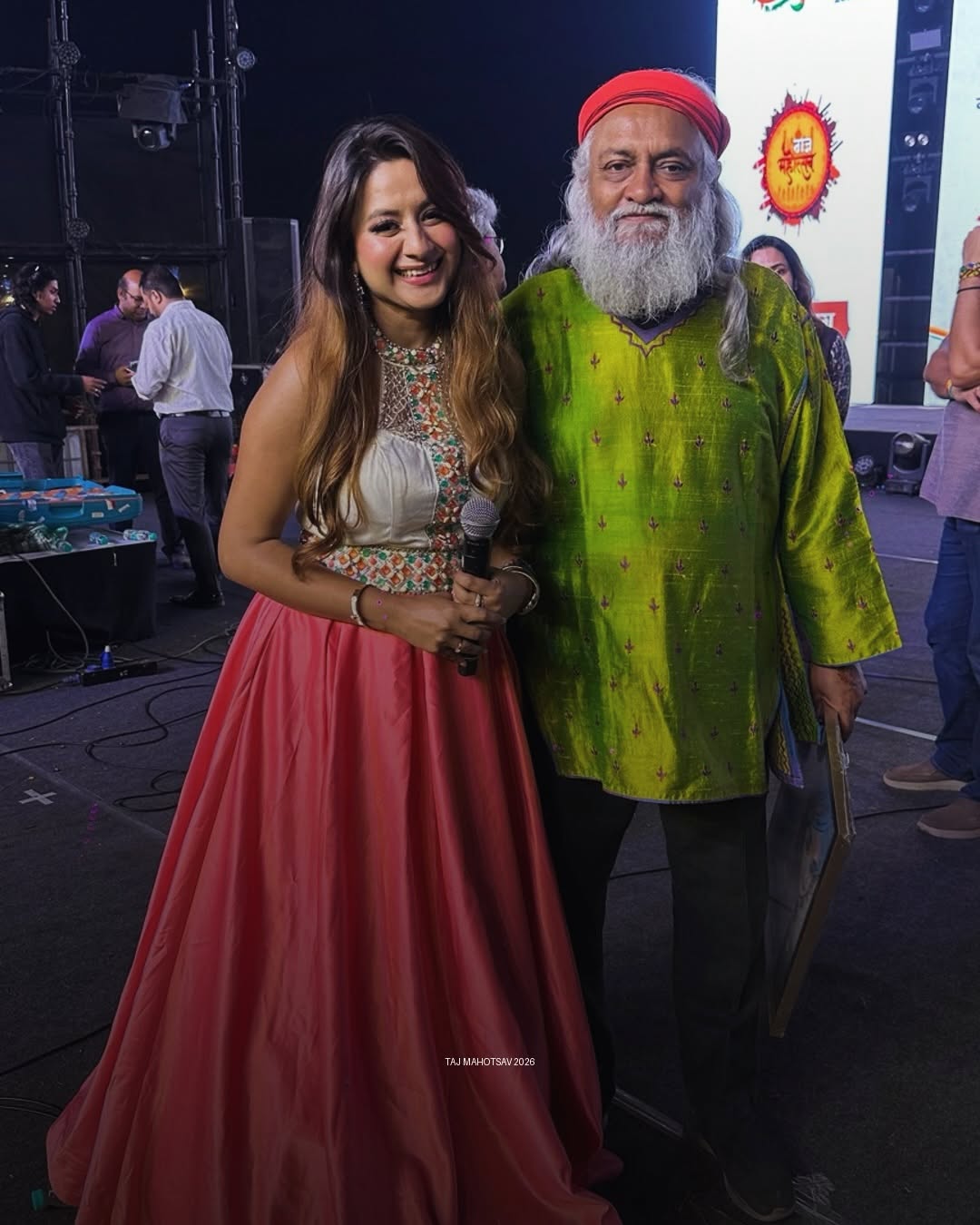 Nikita Rajput on stage with a celebrated musician at Taj Mahotsav